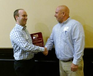 Mark Demidovich (L), congratulates Alan Davis of the Georgia Department of Transportation on winning the 2016 ITS Georgia Best of ITS Project of Significance Award