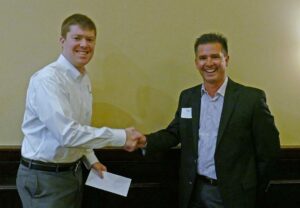 William Woolery (L), receives a check for being awarded an ITS Georgia 2016 Wayne Shackelford Scholarship from Keary Lord